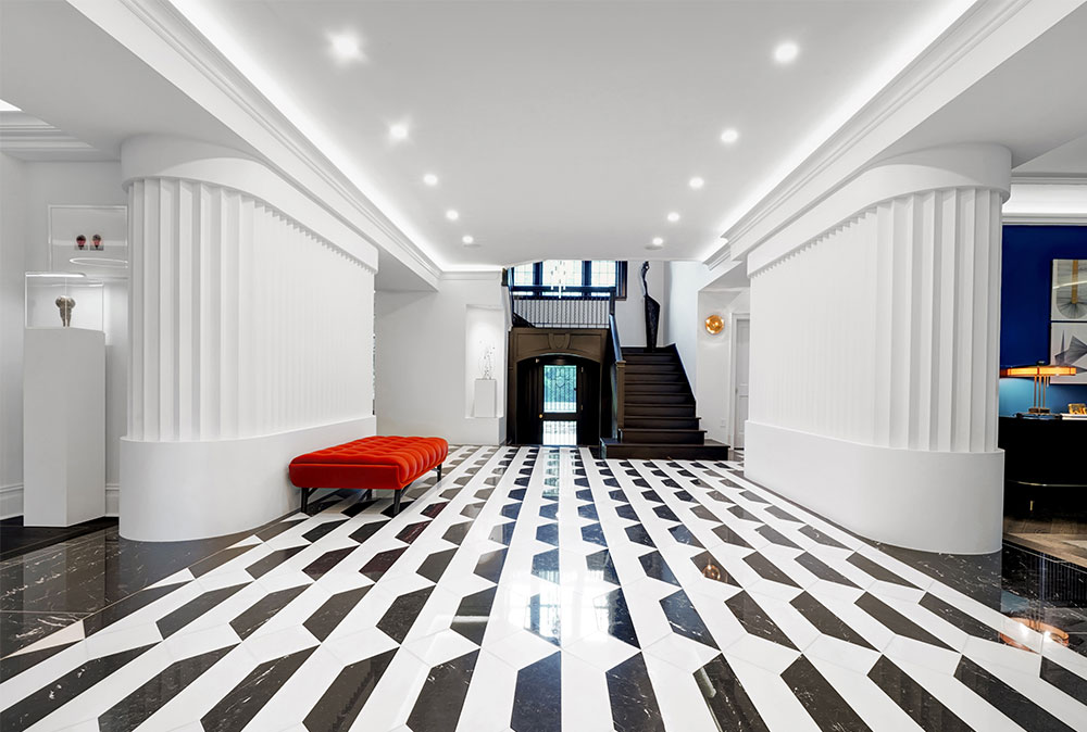 Black-and-white-tiled indoor walkway in a custom home