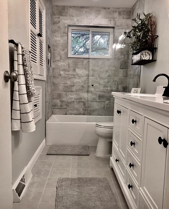 Bathroom with shower window against grey wall