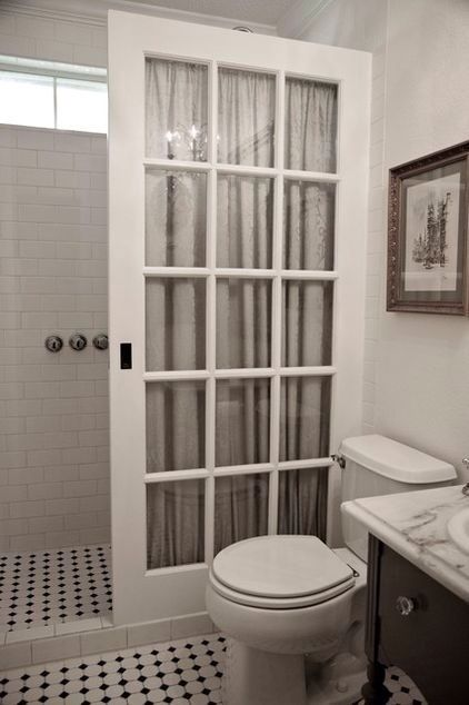Chess-tiled bathroom with toilet and shower