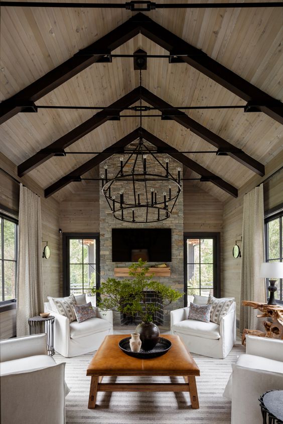 Custom home with interior A-frame and wood dinner table in center