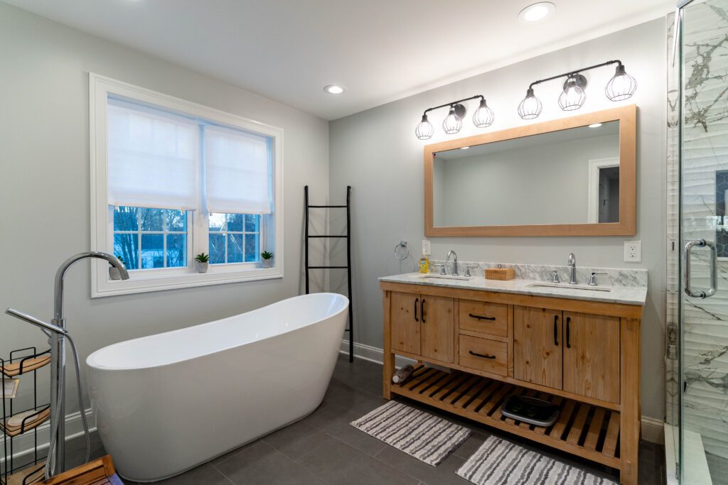 Luxury bathroom with a tub, ladder, and wood décor