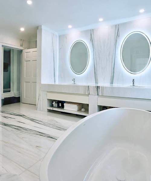 modern bathroom remodel design with two mirrors.