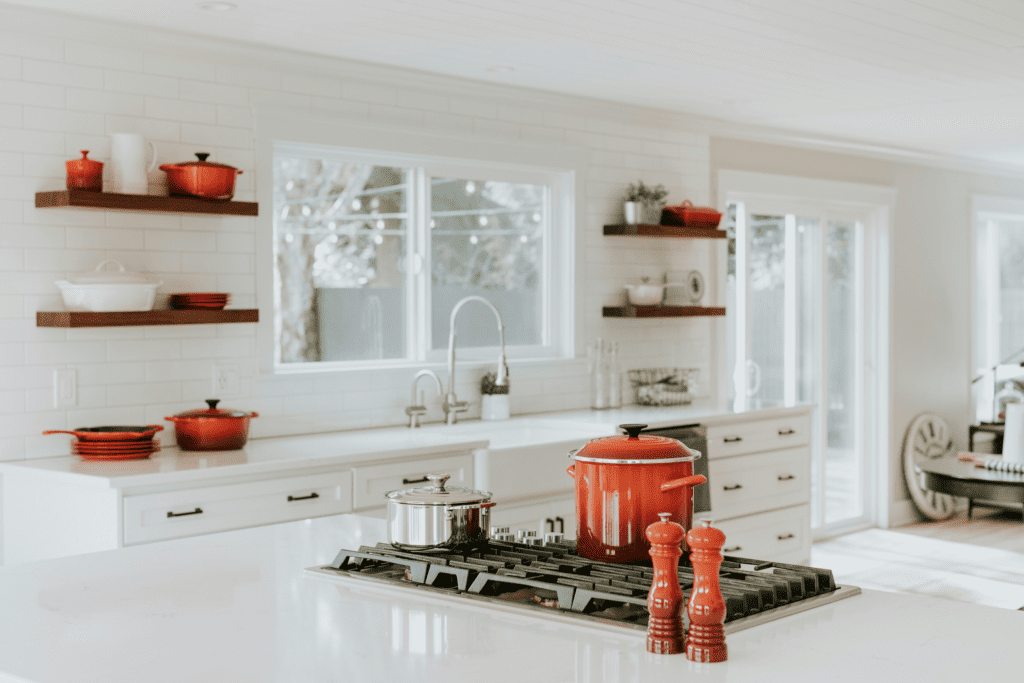 High-quality cookware and tools themed in red orange