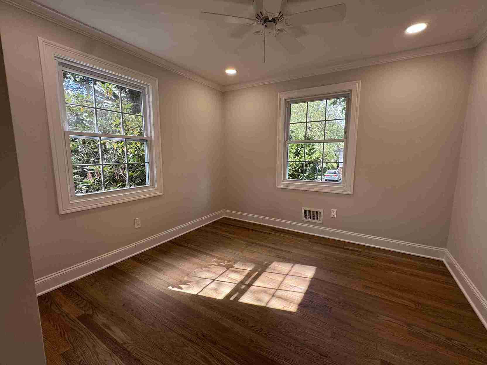 Stylish bedroom makeover showcasing accent wall, modern lighting, built-in shelving and cozy minimalist furniture.