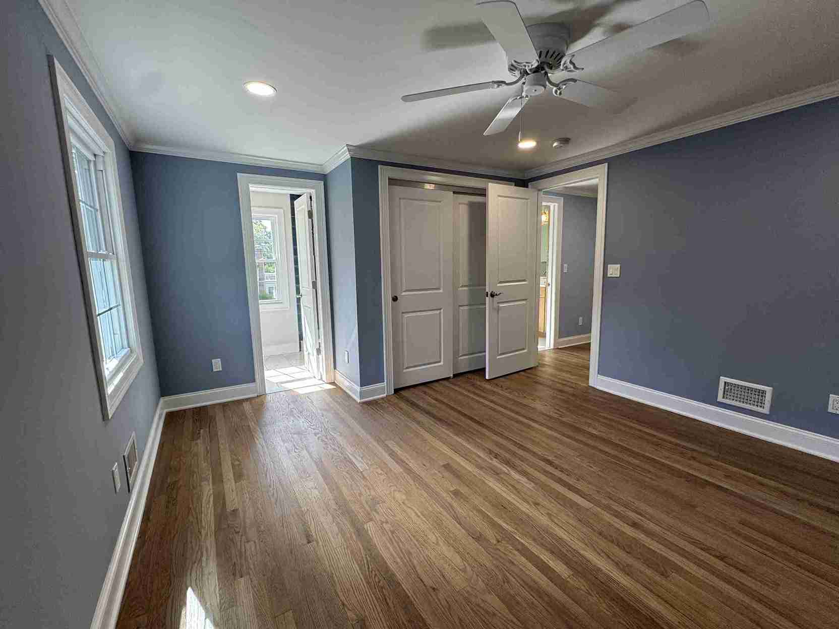 Bright family bathroom renovation with glass shower enclosure light grey tile, contemporary vanity and chrome fixtures throughout