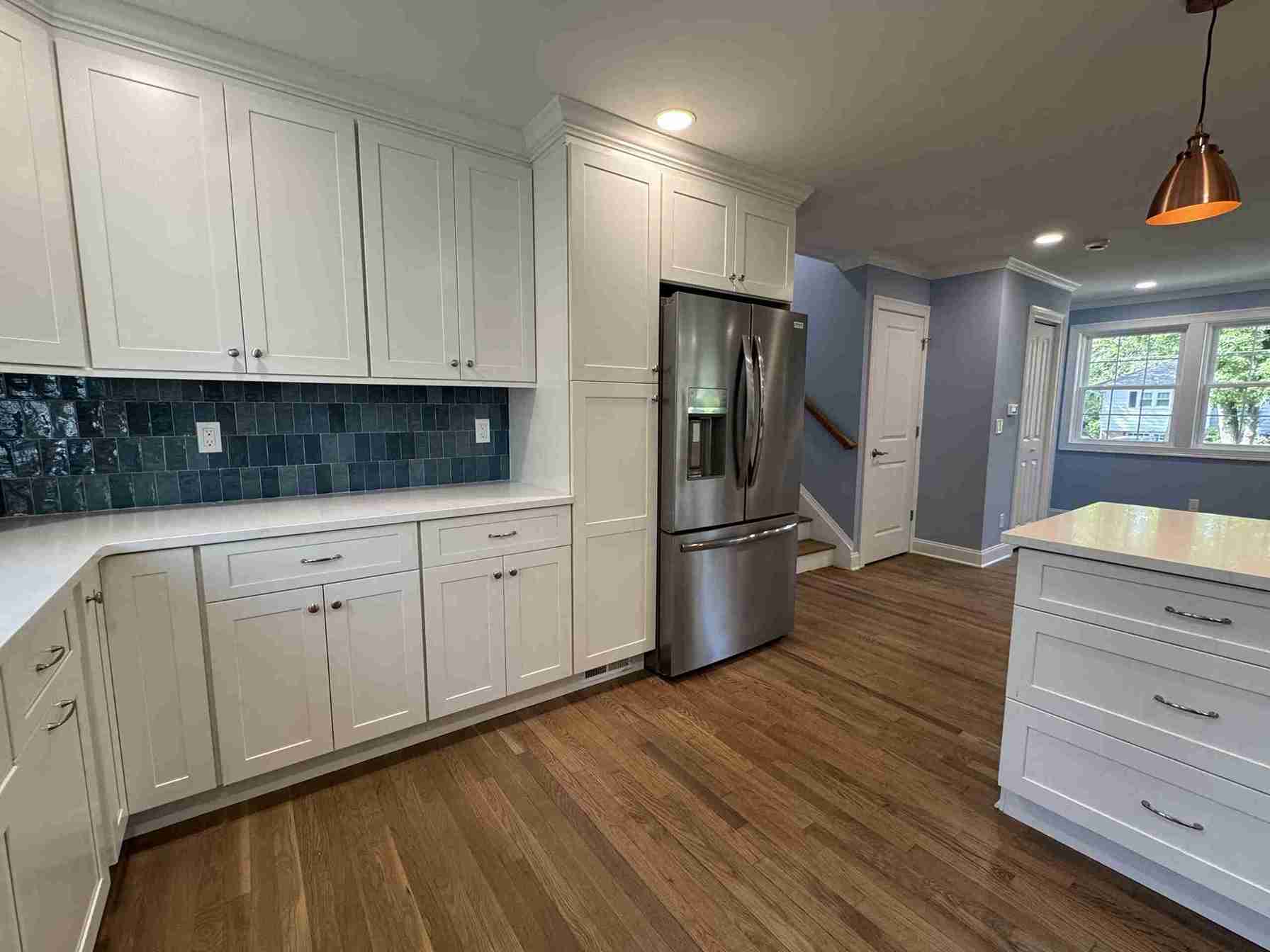 Elegant master bedroom suite redesign with neutral palette, built-in wardrobe, soft lighting and hardwood flooring.