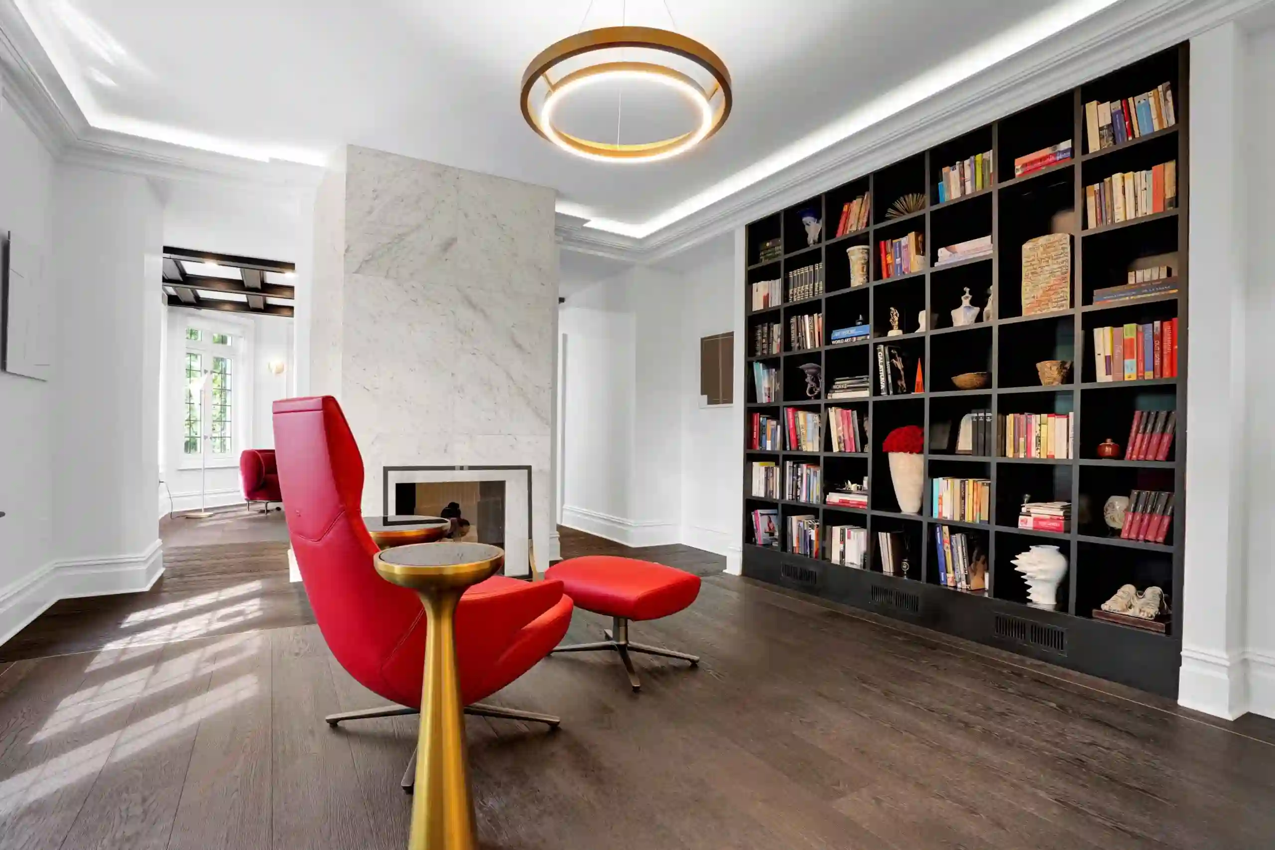 beautiful interior with a book shelf with red theme