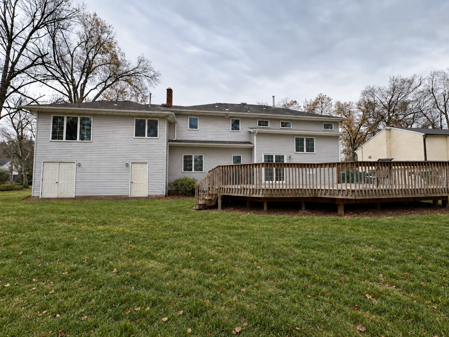 Construction in progress: addition rear deck with siding