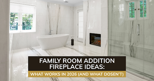 Luxury bathroom with soaking tub, glass shower, white fireplace, marble walls, and bright natural light.