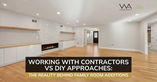 Bright family room addition with built-in fireplace, hardwood floors, and clean modern white interior finishes.